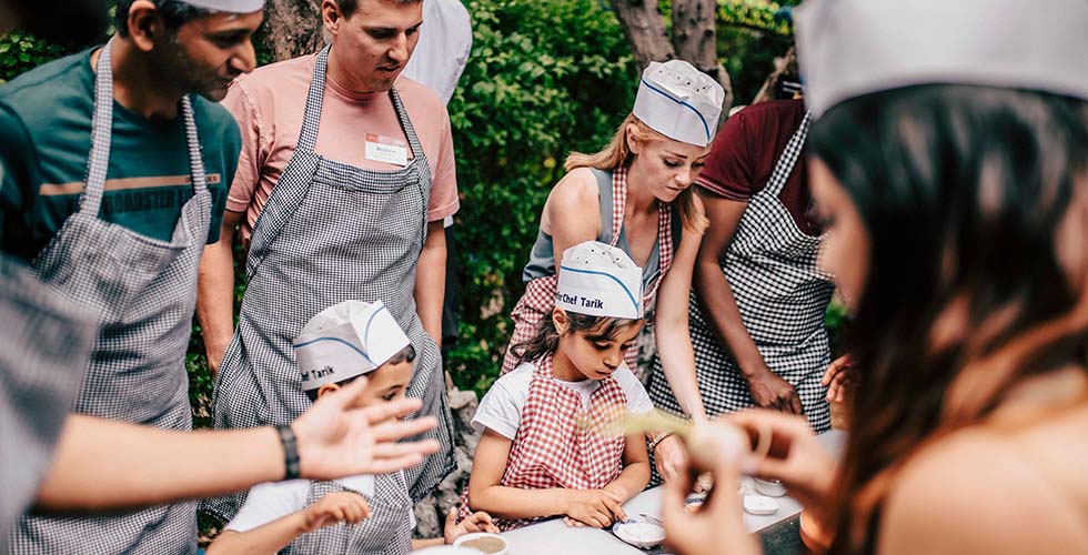 Children from Atlas Kinder Village played sous chef during a cooking class.